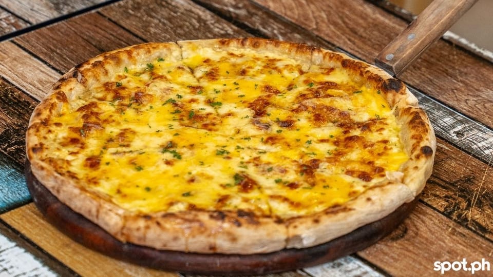 Umpay's Four Cheese Truffle Pizza is perfect for cheese lovers